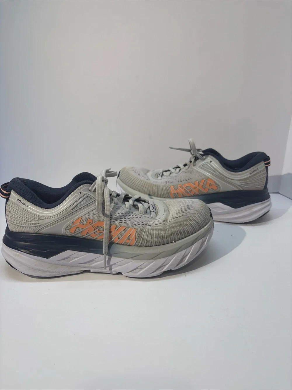 Hoka women’s size 7 gray/peach Bindi 7 style #110531 LRBI in fair condition.